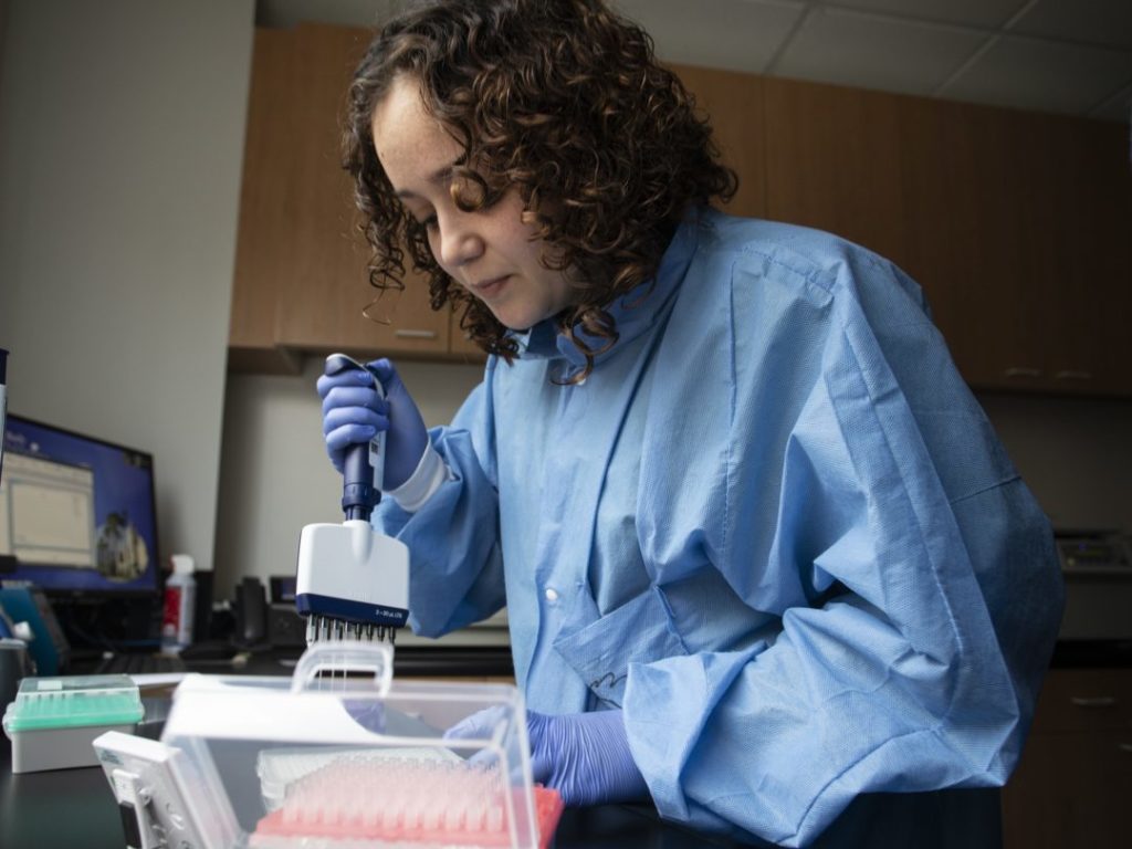 RCIGM lab tech at work
