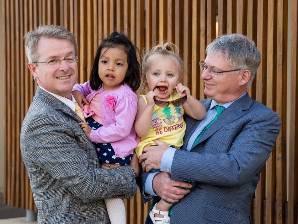 Photo of Patrick Frias and Stephen Kingsmore with patients Sebastiana and Rylee