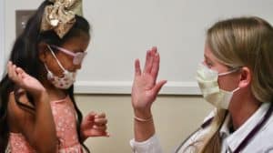 doctor high-fiving girl