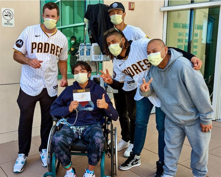 Mario in wheelchair with members of the Padres